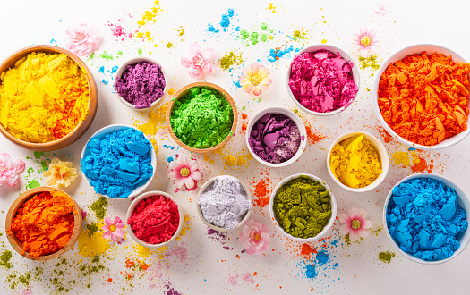 Happy Holi decoration, the indian festival.Top view of colorful holi powder on white background.