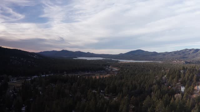 Wide rising aerial shot of Big Bear Lake during the winter in Southern California. 4K