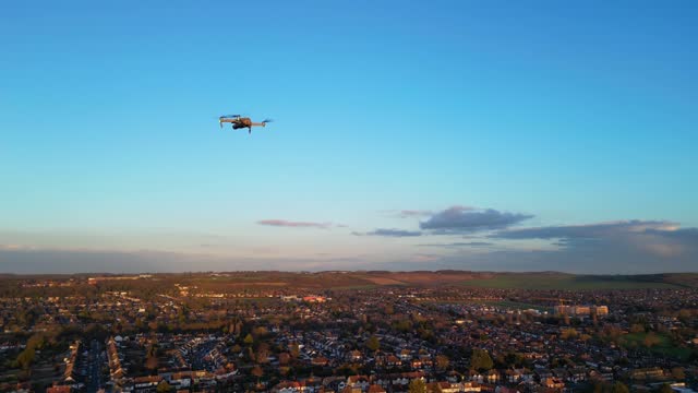 Drone is Flying over British City During Sunset