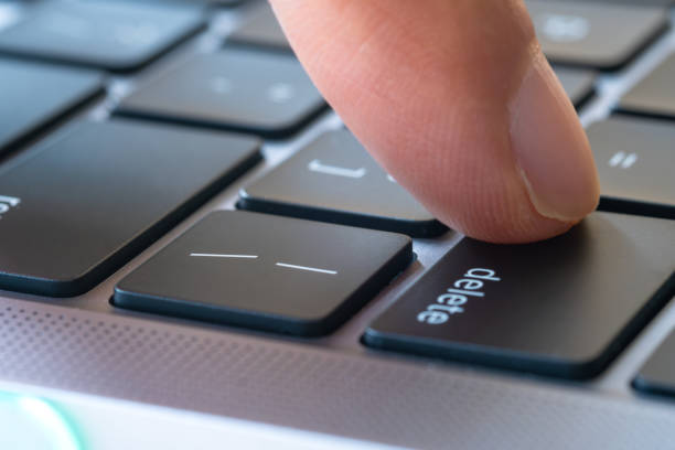 istock Finger of the computer user, he presses the delete button on the computer keyboard. 2044648959