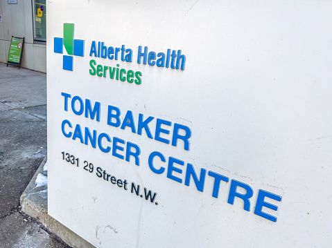 Calgary, Alberta, Canada. Feb 25, 2024. A close up to an Alberta Health Services TOM BAKER CANCER CENTRE sign.