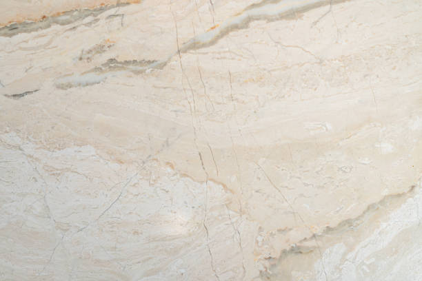 istock Textured, warm toned, natural marble stone surface and background 2044663522
