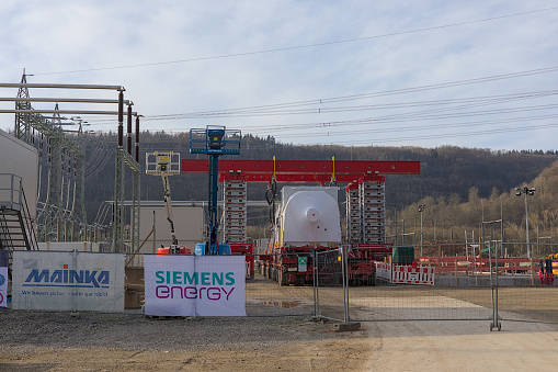 Würgassen, Germany - 02/24/2024: Construction of a rotating phase shifter system for grid stabilization by Siemens Energy at the Würgassen substation grid connection point