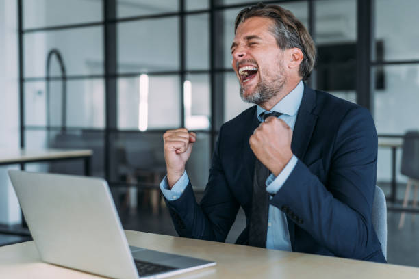 istock Handsome businessman celebrating his success. 2044758785