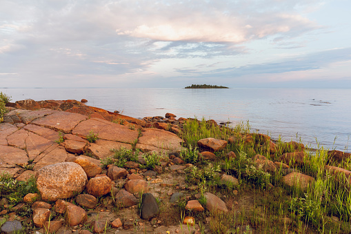 A tranquil scene by the sea on a calm summer evening, Northern Finland