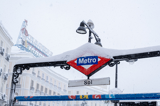 Madrid, Spain; January 9 2021: Metro de Sol at Sol in Sol in Madrid on a snowy day