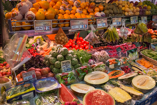 Horizontal view of the merchandise of a greengrocer in the old Abaceria Central Market of the Gracia neighborhood in Barcelona