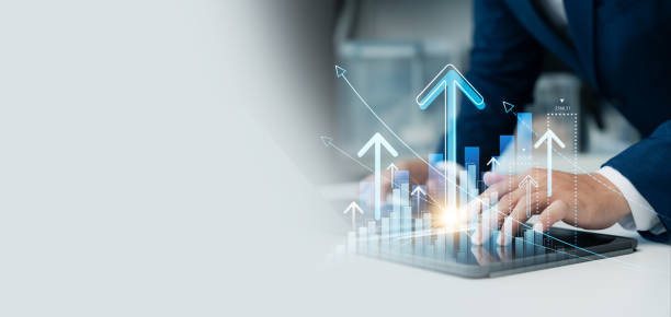 istock Businessman use laptop and tablet analyzing company growth, future business growth arrow graph, development to achieve goals, business outlook, financial data for long term investment. 2044795042