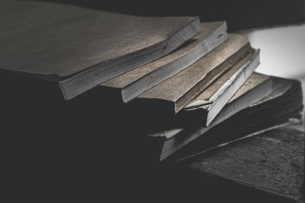 istock A stack of books in a dark place exposed to light from a window 2044796643