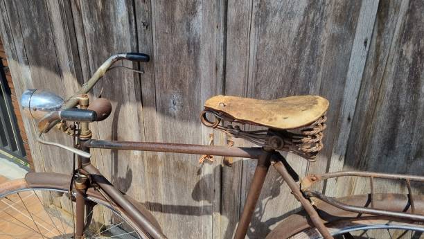 istock Vintage bicycle on old rustic dirty wall house 2044800247