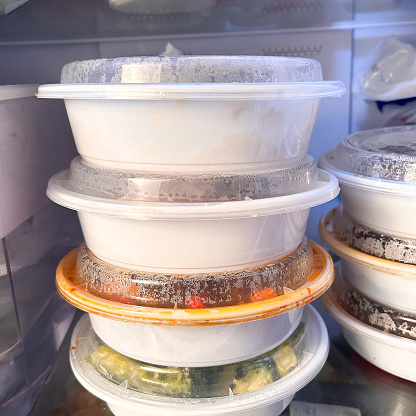 Close Up Of White To Go Containers Stacked In A Fridge