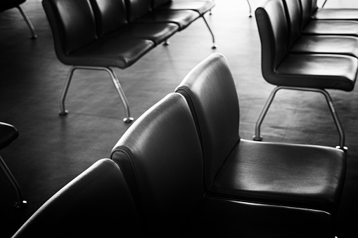 Monochrome image of waiting room bench