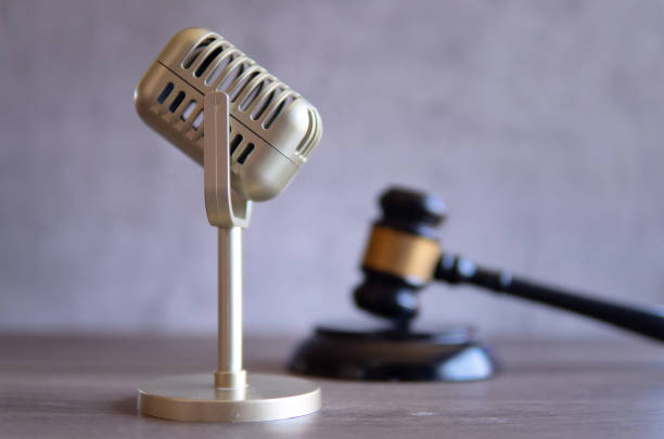 istock Closeup image of microphone and judge gavel. 2044828383