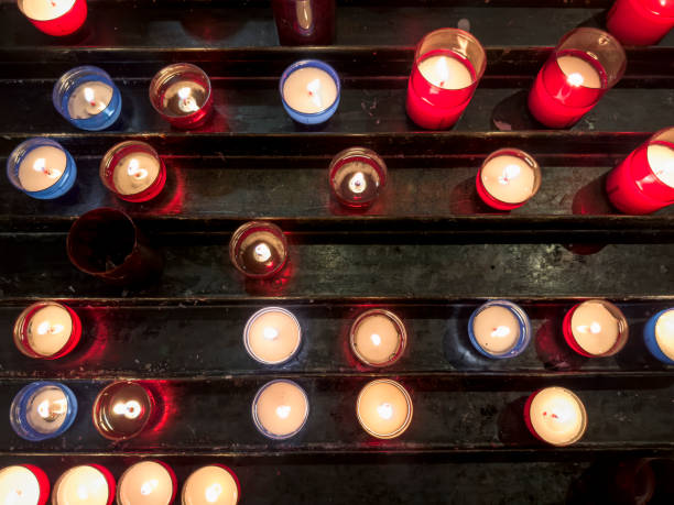 Close up praying candles in church in France