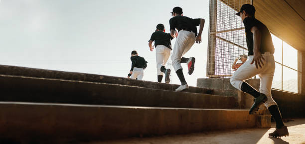 istock Baseball team, exercise and sport stadium training of professional athlete group doing a workout. Running, softball and cardio of sports game people doing a action run to pitch on field with mockup 2044842662