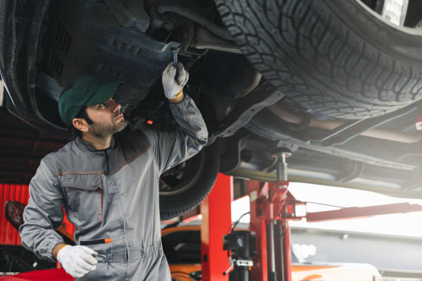 istock Professional automobile maintenance checking car damage broken part condition with clipboard. Diagnostic and repairing vehicles at garage automotive. 2044868027