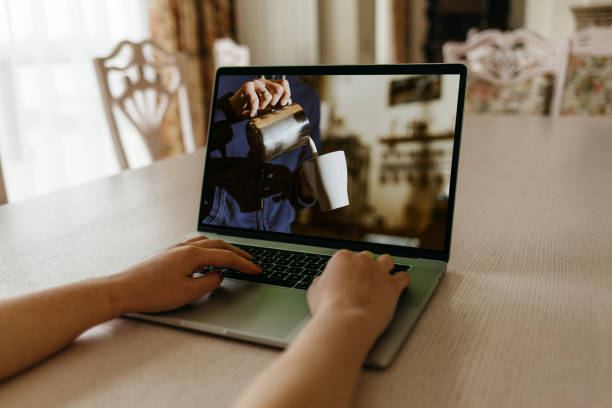 istock woman learning to make coffee while looking at online lessons on a laptop 2044879794