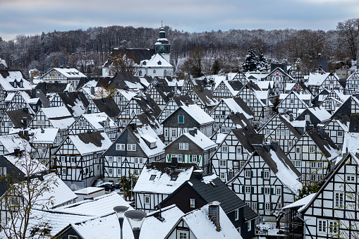 aerial view  over little village in winter landscape