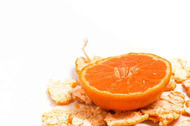Close-up peel and half cut fresh organic orange delicious fruit isolated on white background clipping path