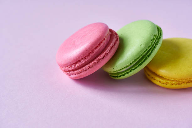 istock Colorful macaroons on a pink background. Close up. 2044932975
