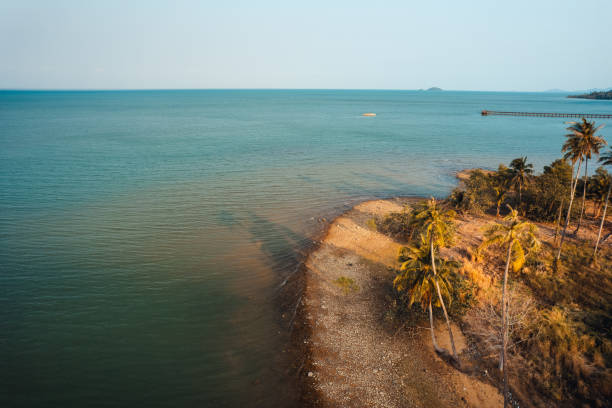 istock Orange beach and coconut trees in the evening 2044936201