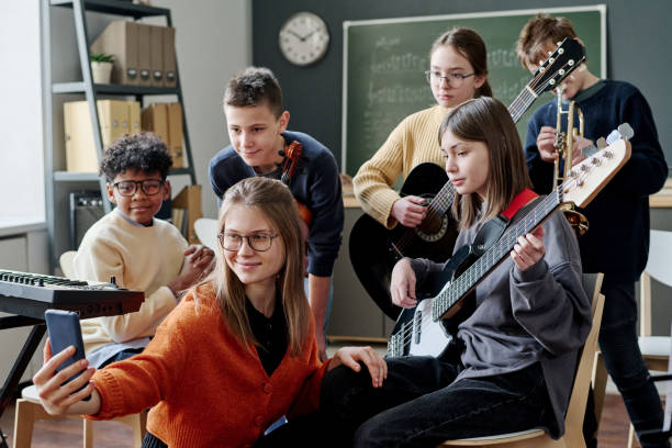 istock Music Teacher Taking Selfie With Students 2044950591
