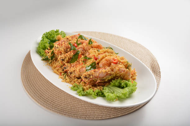 istock chef cook wok fried big tiger prawn with crispy butter cereal curry leaf chilli in plate on white table seafood restaurant asian cafe halal chinese banquet menu 2044996028