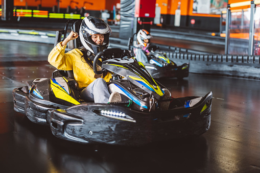 go cart race asian girl screaming when winning the race angry competitor