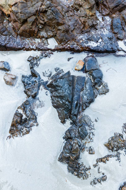 istock Stones on the sandy beach. 2045024684
