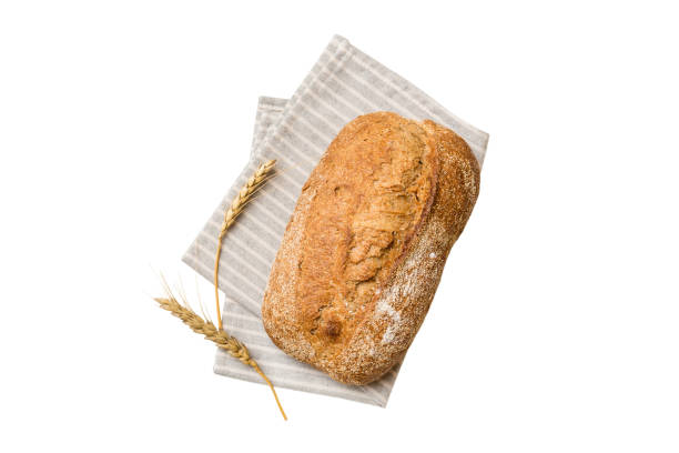 istock Fresh Homemade Whole Wheat Bread. bread on napkin isolated on white background, fresh bread top view 2045026357