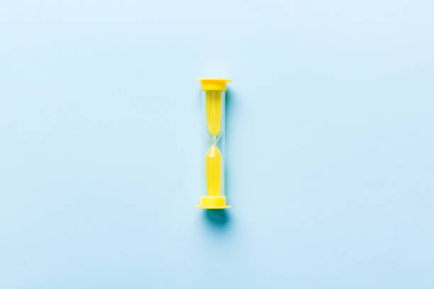 hourglass on the table, sand clock as time passing concept for business deadline, copy space.