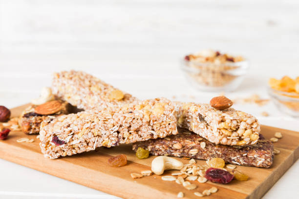istock Various granola bars on table background. Cereal granola bars. Superfood breakfast bars with oats, nuts and berries, close up. Superfood concept 2045027543