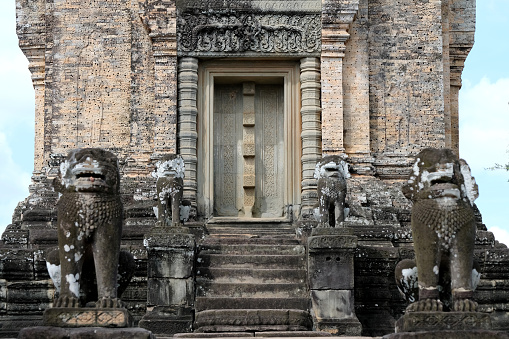 Guardian sculptures at the East Mebon, a 10th Century temple at Angkor, Cambodia. Built during the reign of King Rajendravarman, it stands on what was an artificial island at the center of the now dry East Baray reservoir.