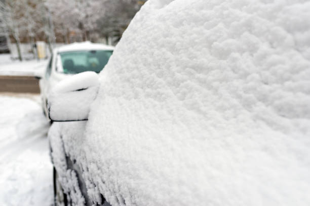 istock Snow-covered car windshield.Detail of a car covered with snow.Selective focus. 2045042696