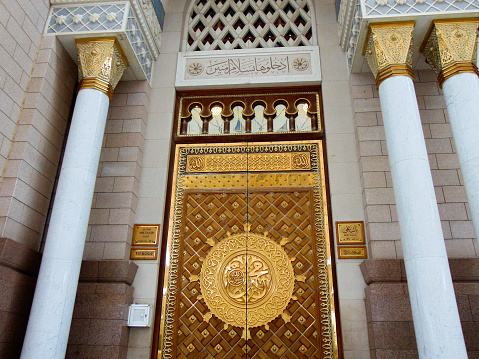 Medina, Saudi Arabia - Oct 27, 2023: A front view of the golden door of Ali ibn Abi Thalib gate at the Prophet's Mosque, Al-Masjid An-Nabawi.