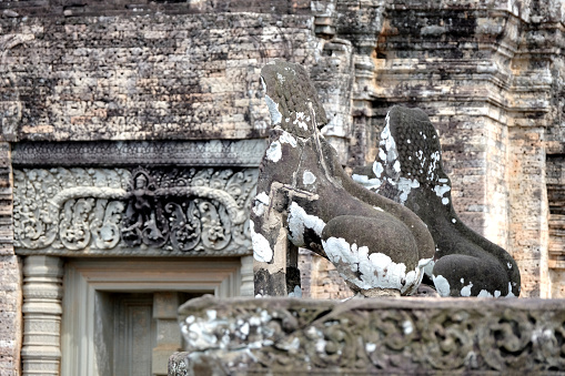 Guardian sculptures at the East Mebon, a 10th Century temple at Angkor, Cambodia. Built during the reign of King Rajendravarman, it stands on what was an artificial island at the center of the now dry East Baray reservoir.