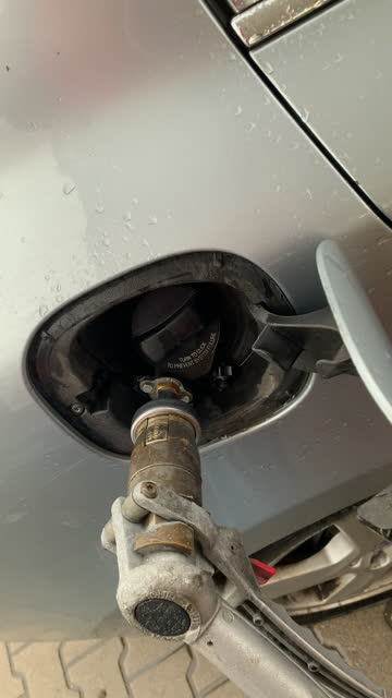 LPG filling of car in a gas station
