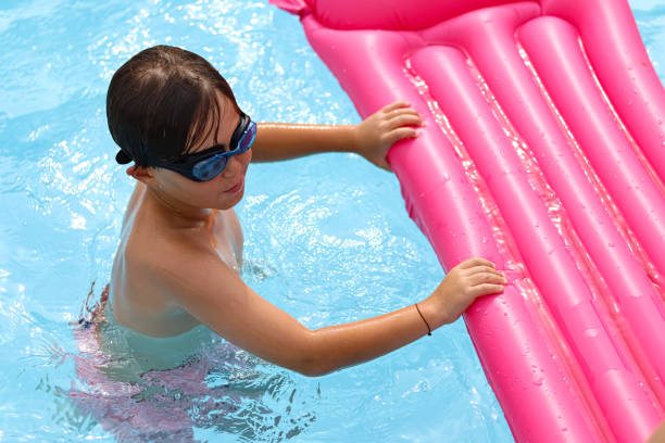 istock A child on an inflatable mat in the pool 2045055181