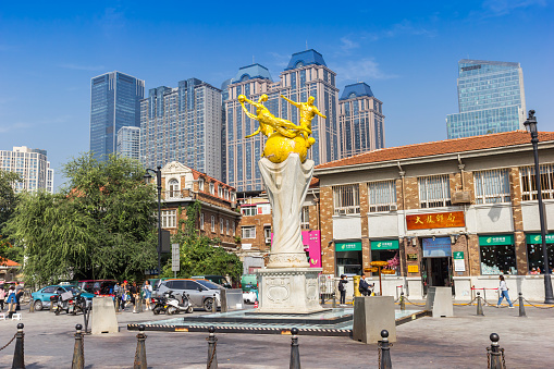 Soccer statue and historic post office on the Minyuan square in Tianjin, China