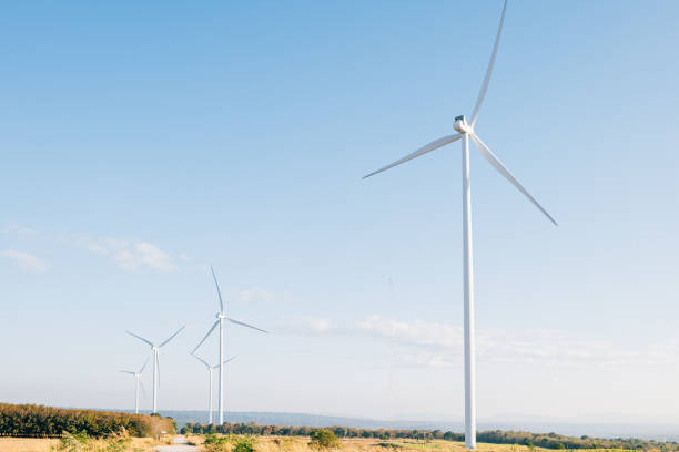 istock Amidst nature's beauty windmills spin on a mountain farm generating clean electricity 2045081539