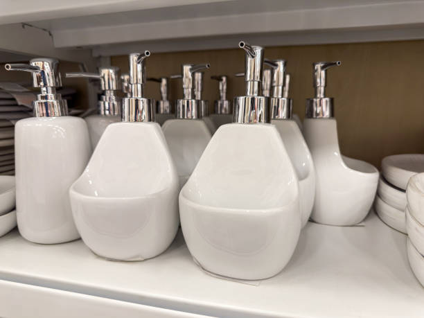 white liquid soap dispenser on a shelf lying in a store, object interior room background
