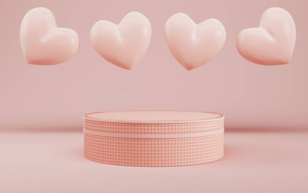 Cylindrical podium fro product display with hearts on bright cream color background in pastel colors stock photo