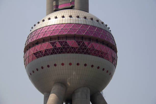 Looking up at the Oriental Pearl TV Tower Tower and the starry background at night