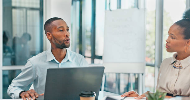 istock Communication, black man or business people in meeting on laptop for analytics, planning or research. Project management, discussion or group collaboration on tech for agenda, feedback or team review 2045115924
