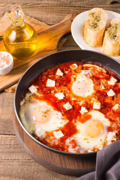 istock Shakshuka made of poached eggs in tomato pepper sauce 2045123164