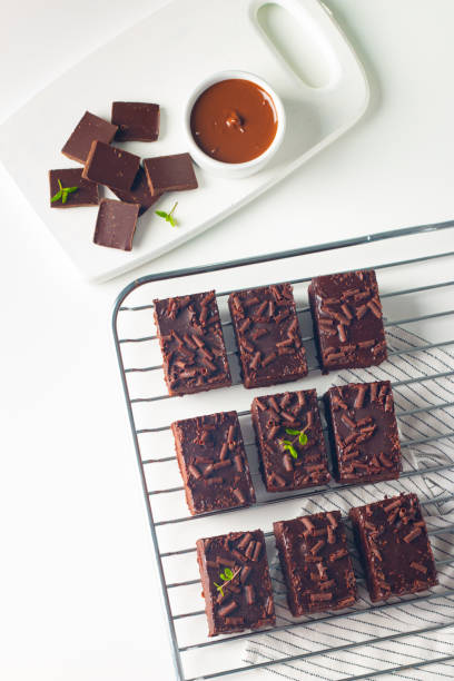 istock Delicious chocolate brownies with mint on white background. Sweet cake concept. 2045123199
