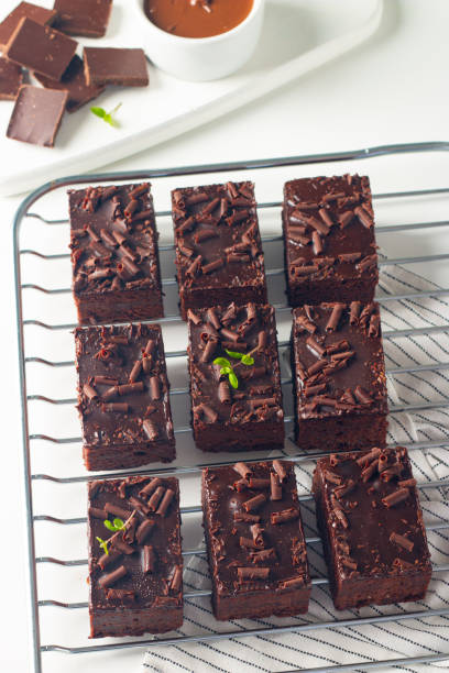 istock Delicious chocolate brownies with mint on white background. Sweet cake concept. 2045123204