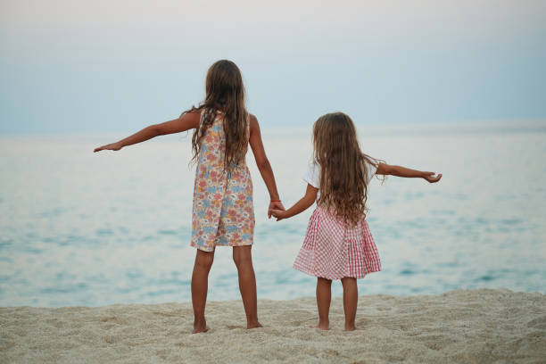 Beautiful sisters enjoying summer vacation.