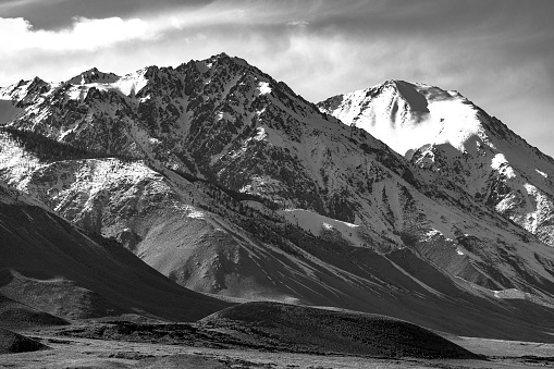 a black and white image of one of the mountains that make up the eastern portion of the Sierra Nevada mountain range in california.