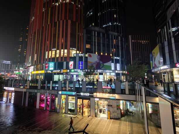 people walking in sanlitun soho, beijing, china - sanlitun imagens e fotografias de stock